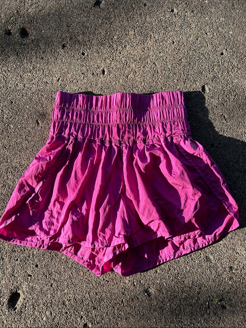 Free People Movement High-Waist Pink Elastic Smocked Shorts running